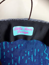 Load image into Gallery viewer, Teal and blue flower and feather headpiece.