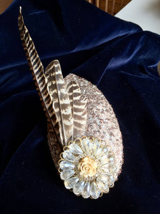 Pheasant and sequin headpiece.