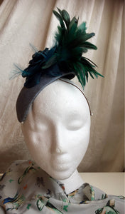 Teal and blue flower and feather headpiece.
