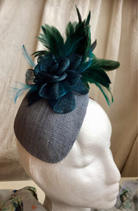 Teal and blue flower and feather headpiece.